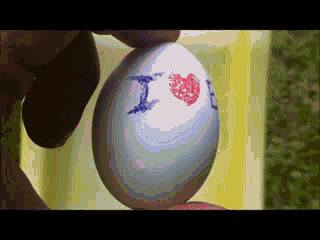 "I ♥ E-Poetry Easter Poem" by Leonardo Flores. A white egg is rotated to display the title of the work. Text: "I (heart) E-Poetry"